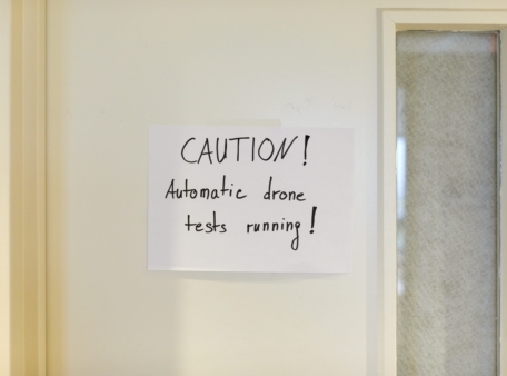 Caution automatic drone test running sign